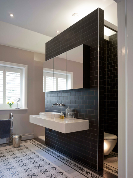 bathroom with dividing wall and suspended sanitaryware