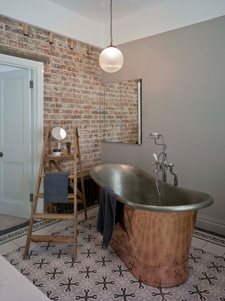 Madeira Road, bathroom unsuite with freestanding copper bath and tiled floor and brick walls