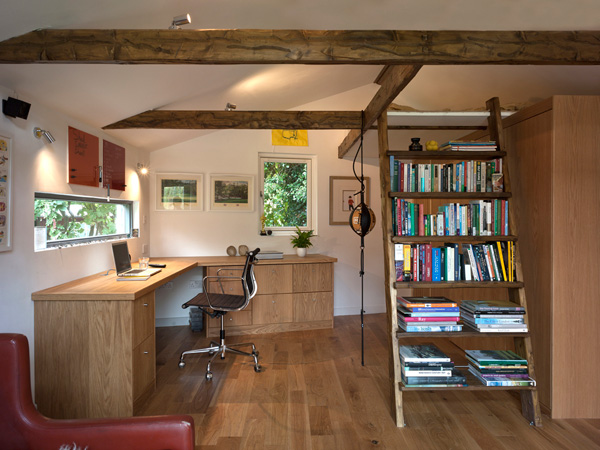 Garden Office / Gallery / Den internal view showing joinery, timber structure, furniture and artwork