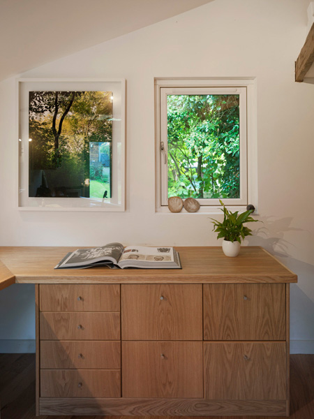 Garden Office / Gallery / Den internal detail with built in joinery, window and artwork